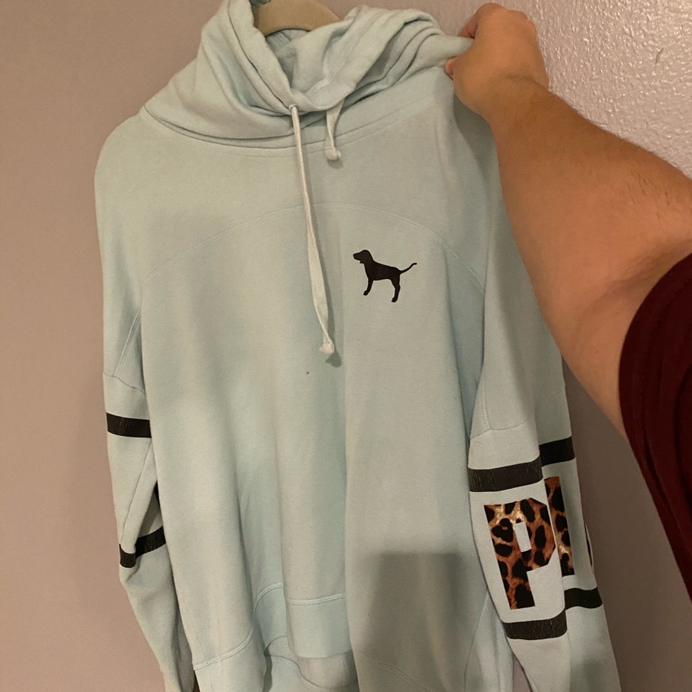 Blue sweater by pink